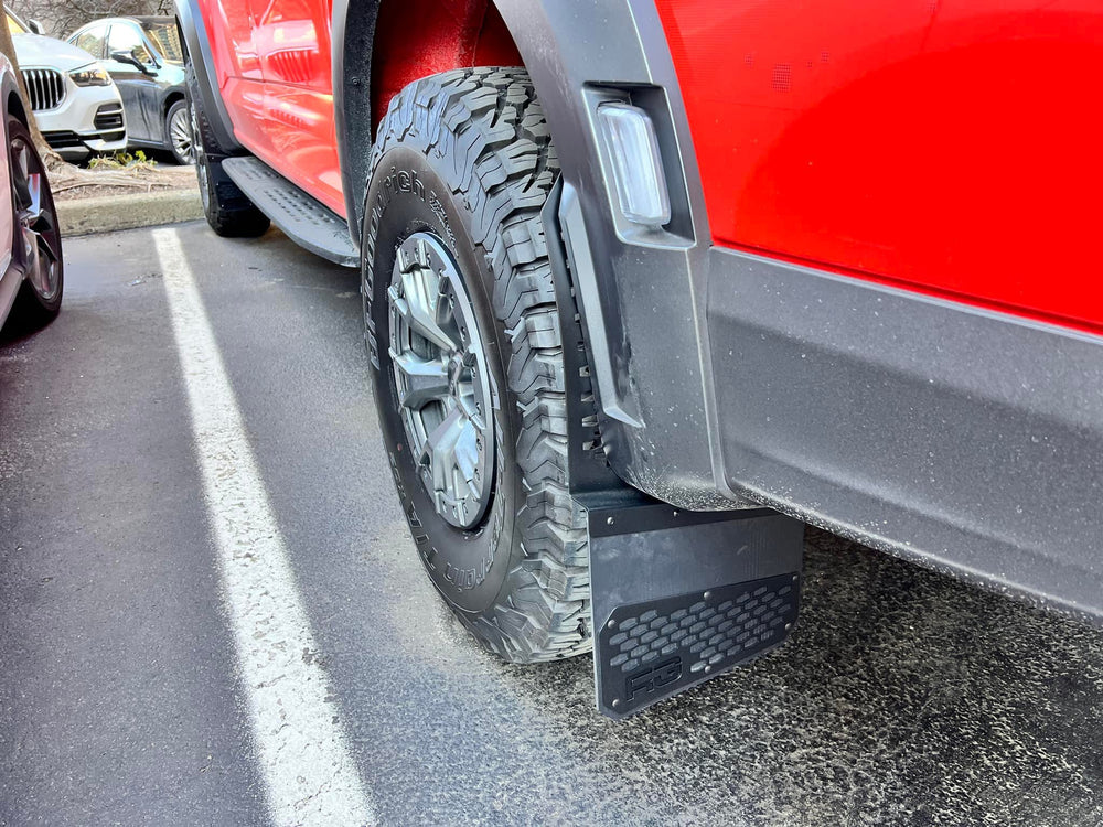 RekGen flap behind the rear tire of a red truck